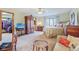 Spacious main bedroom with a walk-in closet, ceiling fan, and sitting area at 168 Yorkshire W Blvd, Cumberland, IN 46229