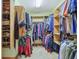 Walk-in closet featuring built-in shelving, rods, and organized storage solutions at 168 Yorkshire W Blvd, Cumberland, IN 46229