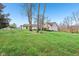 A lush green lawn surrounds a beautiful home, providing a serene outdoor setting at 168 Yorkshire W Blvd, Cumberland, IN 46229