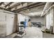 Unfinished basement featuring painted block walls and exposed ceiling with pipes at 1710 S Butler Ave, Indianapolis, IN 46203