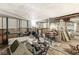 Unfinished basement with exposed plumbing, some tile flooring, and retro wood paneling at 1710 S Butler Ave, Indianapolis, IN 46203