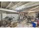 Basement with unfinished ceiling and cement floors used to store bikes and other equipment at 1710 S Butler Ave, Indianapolis, IN 46203