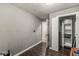 Bedroom with wood floors and an open closet, neutral gray walls at 1710 S Butler Ave, Indianapolis, IN 46203
