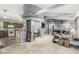 View of the open living room showcasing a stone fireplace and an open view to the kitchen at 1710 S Butler Ave, Indianapolis, IN 46203