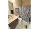 Bathroom featuring a single vanity with granite countertops and a decorative shower curtain at 18756 Brookston Ln, Noblesville, IN 46062