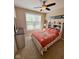 Bright bedroom featuring a colorful comforter and a large window at 18756 Brookston Ln, Noblesville, IN 46062