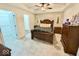 Spacious bedroom featuring tray ceilings and a classic bed frame at 18756 Brookston Ln, Noblesville, IN 46062