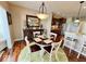 Dining area is set between the kitchen and living spaces, and features hardwood floors and a modern light fixture at 18756 Brookston Ln, Noblesville, IN 46062