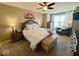Spacious main bedroom featuring a large bed, sitting area, and ample natural light at 18756 Brookston Ln, Noblesville, IN 46062