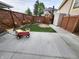 An expansive backyard featuring a shed, arbor, and a paved area, offering endless possibilities for outdoor enjoyment at 23 N West St, Shelbyville, IN 46176