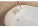 Elegant brass fixtures and faucet on white bathtub with high end fixtures at 23 N West St, Shelbyville, IN 46176