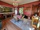 Inviting dining room with chandelier, hardwood floors, and ample natural light at 23 N West St, Shelbyville, IN 46176