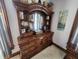Elegant wood dresser with decorative mirror and shelving provides ample storage at 23 N West St, Shelbyville, IN 46176