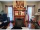 Elegant fireplace with decorative mantel, framed by windows and stylish accents at 23 N West St, Shelbyville, IN 46176