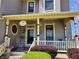 Inviting front porch with white railing and elegant details, leading to the front door at 23 N West St, Shelbyville, IN 46176