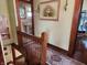 Upstairs hallway with decorative carpet runner leading to a bathroom at 23 N West St, Shelbyville, IN 46176