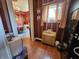 Hallway showing a view of a chandelier and a dining area at 23 N West St, Shelbyville, IN 46176