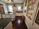 Galley style kitchen featuring an island, pantry, and hardwood floors at 23 N West St, Shelbyville, IN 46176