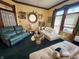 Comfortable living room with decorative art, unique windows, and two white sofas at 23 N West St, Shelbyville, IN 46176
