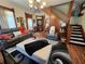 Well-decorated living room with comfortable seating, staircase, and classic design elements at 23 N West St, Shelbyville, IN 46176