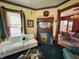 A fireplace with decorative tile and a white sofa can be seen from the living room at 23 N West St, Shelbyville, IN 46176