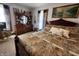 This spacious main bedroom includes carpeted floors and coordinating wood furniture at 23 N West St, Shelbyville, IN 46176