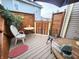 Relax on this home's quaint patio, featuring comfortable seating and privacy fence, perfect for enjoying the outdoors at 23 N West St, Shelbyville, IN 46176