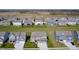 Aerial view of a well-planned residential community with spacious homes and a peaceful, rural backdrop at 2428 S Stonehill Way, New Palestine, IN 46163