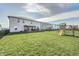 Spacious backyard featuring a wooden deck and a playground at 2428 S Stonehill Way, New Palestine, IN 46163