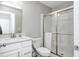 Bathroom with a walk-in shower, white cabinets, and modern fixtures at 2428 S Stonehill Way, New Palestine, IN 46163