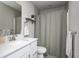Clean bathroom with white vanity, shower-tub combo, and neutral color scheme at 2428 S Stonehill Way, New Palestine, IN 46163