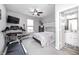 Bedroom featuring neutral walls, a ceiling fan, and ensuite bathroom at 2428 S Stonehill Way, New Palestine, IN 46163
