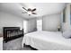 Cozy bedroom features neutral walls, ceiling fan, and room for a crib or other furniture at 2428 S Stonehill Way, New Palestine, IN 46163