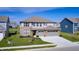 Two-story home featuring a three-car garage, well-kept lawn, and attractive curb appeal at 2428 S Stonehill Way, New Palestine, IN 46163