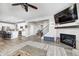 Open-concept living space with a fireplace, and view to the kitchen and living room at 2428 S Stonehill Way, New Palestine, IN 46163