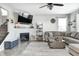 Inviting living room with fireplace, large sectional, and stairway at 2428 S Stonehill Way, New Palestine, IN 46163
