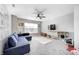 Upstairs living room complete with plush seating and cozy carpet at 2428 S Stonehill Way, New Palestine, IN 46163