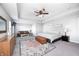 Spacious main bedroom suite features a sitting area, tray ceiling, and modern ceiling fan at 2428 S Stonehill Way, New Palestine, IN 46163