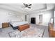 Large main bedroom with trey ceiling, ensuite bathroom, and neutral colors at 2428 S Stonehill Way, New Palestine, IN 46163