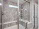 Modern tiled shower with glass door and convenient built-in seating at 2428 S Stonehill Way, New Palestine, IN 46163