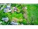 Aerial view of a home with a spacious backyard, large field, mature trees, and scenic surroundings at 260 17Th St, Columbus, IN 47201