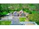 A beautiful aerial view showing the layout of the home, detached garage, and surrounding greenery at 260 17Th St, Columbus, IN 47201