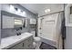 Modern bathroom featuring a shower-tub combo, white subway tile and stylish vanity at 260 17Th St, Columbus, IN 47201