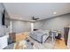 Well-lit bedroom with a ceiling fan, neutral paint and luxury vinyl plank flooring at 260 17Th St, Columbus, IN 47201