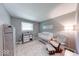 Cozy Bedroom with neutral paint, luxury vinyl plank flooring and a picture window at 260 17Th St, Columbus, IN 47201