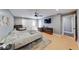 Spacious bedroom featuring a ceiling fan, area rug and a door to the backyard at 260 17Th St, Columbus, IN 47201