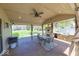 Cozy covered patio with outdoor seating, grill, and stone outdoor kitchen at 260 17Th St, Columbus, IN 47201