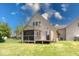 View of a charming screened-in porch and back deck at 260 17Th St, Columbus, IN 47201