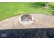 Close-up of the stone fire pit set in a concrete patio at 260 17Th St, Columbus, IN 47201