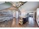 Open floor plan with kitchen island, dining area, and stylish staircase accent wall at 260 17Th St, Columbus, IN 47201